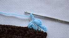 Work ch 3. *Yarn over, insert the hook in space (the center of the flower, needle marked) and pull the loop to a height of 3 chain. Repeat from * 3 times.