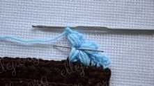 Work ch 1. Work one more puff stitch in the center of the flower exactly the same way as the previous one.