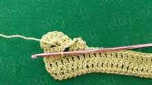 Pull yarn trough all spaces and loop on the hook.