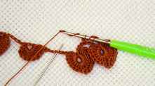 Then do another 2 YO, dc in center ch between leafs. There should be 4 loops on your hook.