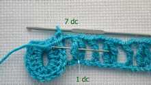 Make the second scale. 7 dc in next tr around (in the needle marked space).