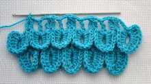 And so on to the end of the row. You can work a double treble crochet (dtr) in center of the last scale.