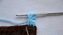 Don't finish puff stitch on the hook. Do the same in the next dc on the base. *Yarn over, insert the hook as inserted needle and pull the loop to a height of 3 chain. Repeat from * 3 times.