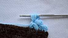 Finish this petal. Yarn over and pull yarn through all loops on the hook.