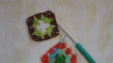 Leave thread from the hook, insert hook in the second dc of the first motif. Yarn over, and pull back.