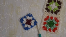 As you can see, the first motif is still not finished.  Take a motif for the next row. Work 2 dc in the corner and join to the first motif of the first row of motifs.