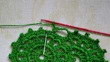 Work ch 2. 1 sc between picots. Insert the hook as on the photo.