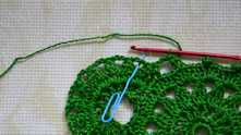 Working * (3 dc, picot, 2 dc) in each space, repeat from * to end of the round.