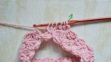 There are 6 loops on the hook. Yarn over, and pull through all loops on the hook.