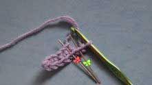 Right away in Row 2, increase. Chain 2. Work 1 row sc’s in the back loop only, beginning with the second from the hook, and continue to insert the hook as shown by the needle with red ribbon.