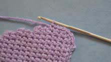 The rate will be about 1 sc per row, only along the round stretches, work 2 sc’s into one spot.