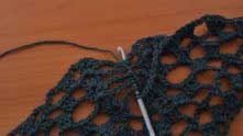 Yarn over (YO), insert hook under chains, YO and pull the loop. 