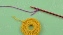 Flower can be worked entirely in one color or two. Fasten off. Weave in ends. Take another color, create the first loop. Single crochet (sc) in any dc.