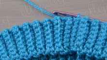 Turn out elastic band to the right side. Continue with round crochet.
