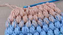 2 puff stitch together at the end of round. Work ch 1. Join round with sl st in top of the first puff stitch.