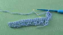 Single crochet (sc) in the second dc on the next group of dcs of the previous row.