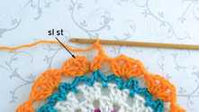 2 dc tog in the first V-stitch, ch 2.