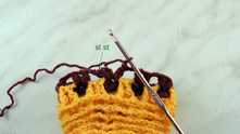 Join row with sl st in the top of first puff stitch.
