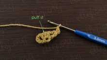 1 puff stitch (3 half double crochet (hdc) together) in the middle dc.