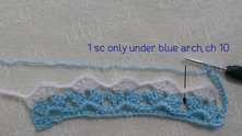 We will work arches of 10 ch around the chains between the shells. Blue arches work ONLY in the blue chains around.