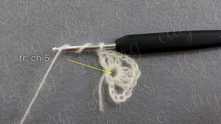 Treble crochet (tr) in the same space. Work ch 5.