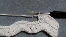 Skip 2 sc. Puff stitch in the next sc.