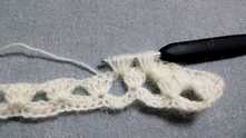 YO and pull yarn through all loops on the hook, except one. YO, and pull through last 2 loops.