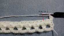 4 dc in the top of 2 puff stitch tog, ch 1, and across the row.