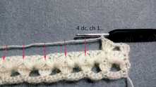 4 dc, ch 1 in each top of 2 puff stitch tog.