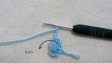 Have made a puff stitch. Turn the work.