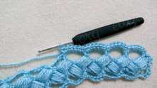 You can work 7 cs in each arch depending of the thin of yarn. And make picot on the top of middle sc.