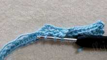 Work 2 unfinished sc-blo, yarn over and pull yarn through all loops on the hook.