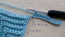 2 sc-blo together, skip 1 st between, 11 sc-blo across.