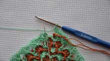 End of the row. Do not forget to bring ginger thread on the right side.